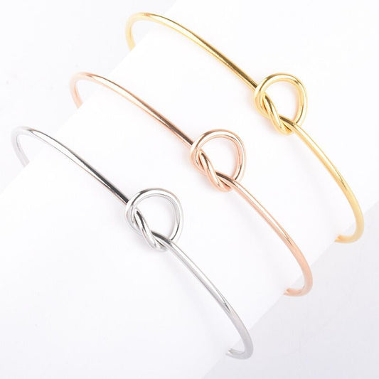 Stylish and simple heart-shaped knotted titanium steel bracelet, open bracelet stainless steel jewelry, wholesale from manufacturers
