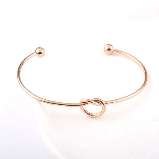 Stylish and simple heart-shaped knotted titanium steel bracelet, open bracelet stainless steel jewelry, wholesale from manufacturers